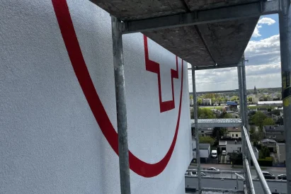 Malowanie logotypów | prace na wysokości | TROLL Techniki Alpinistyczne Katowice